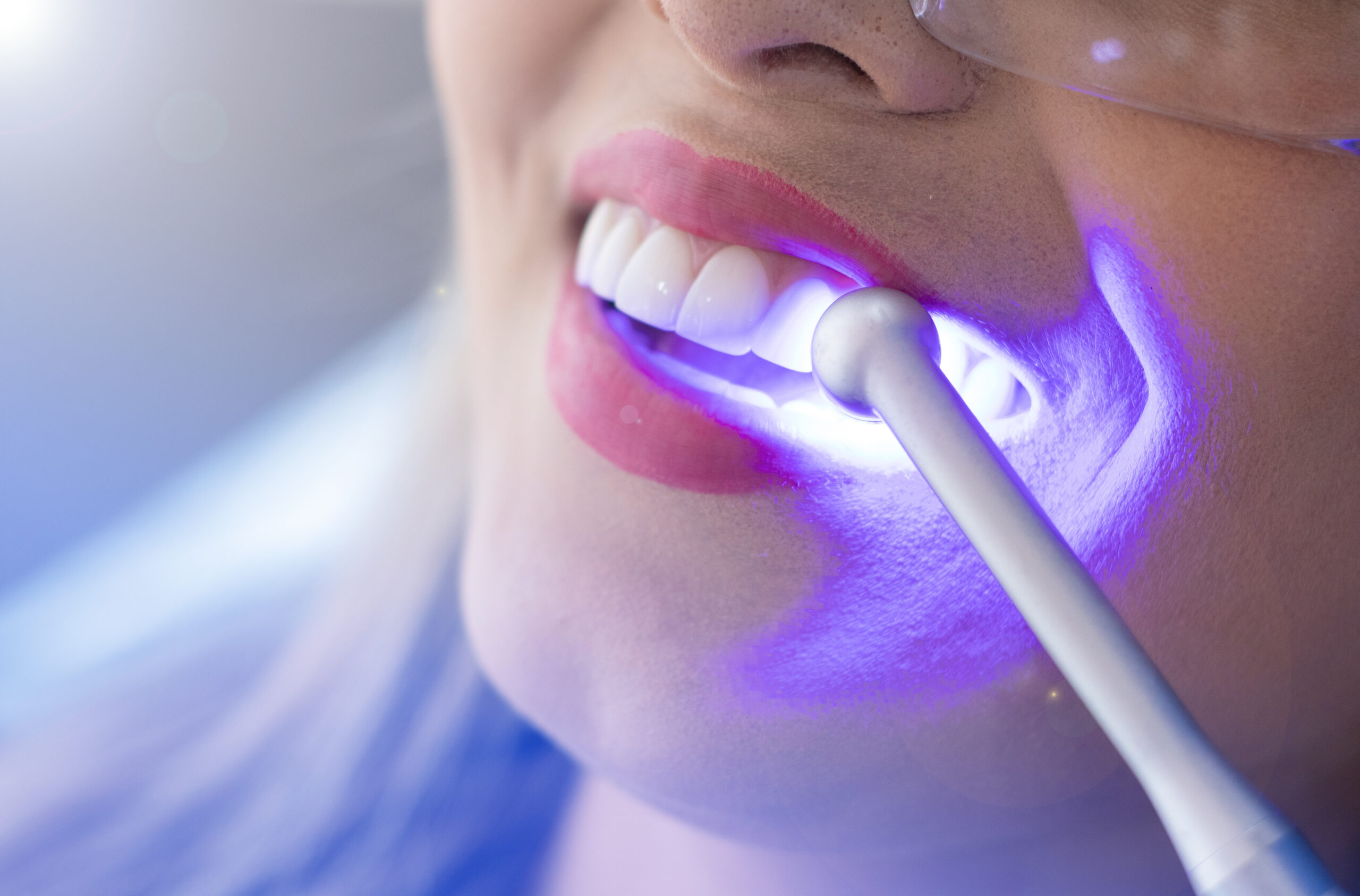 woman having her teeth checked by the dentist in an office